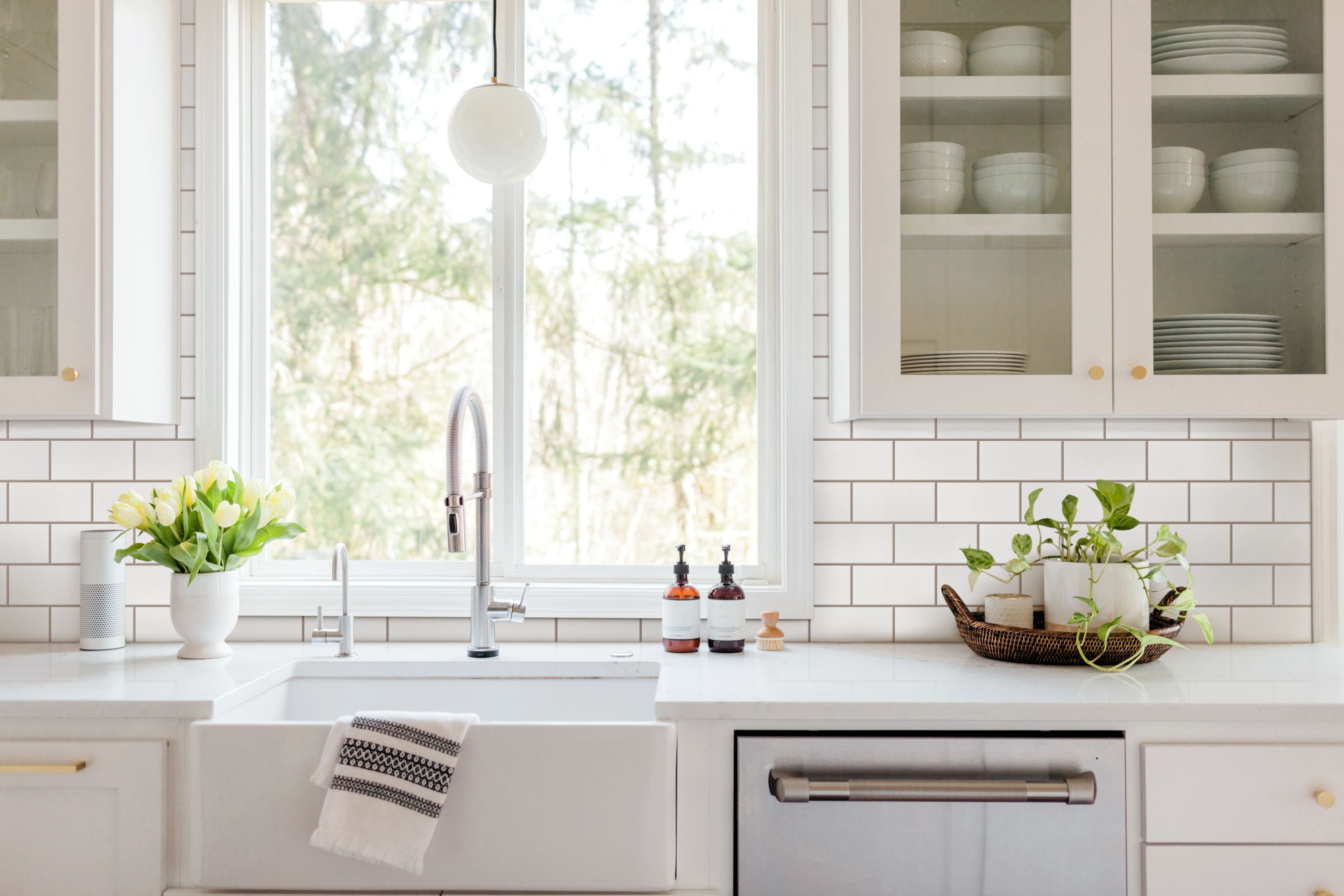 kitchen sink counter with white tile backsplash - Classic Carpets in Midland, TX