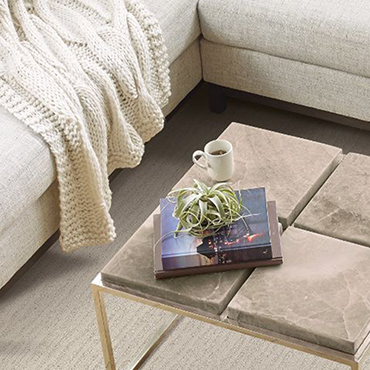 closeup overhead shot of a white sofa on carpet with a small coffee table - Classic Carpets in Midland, TX